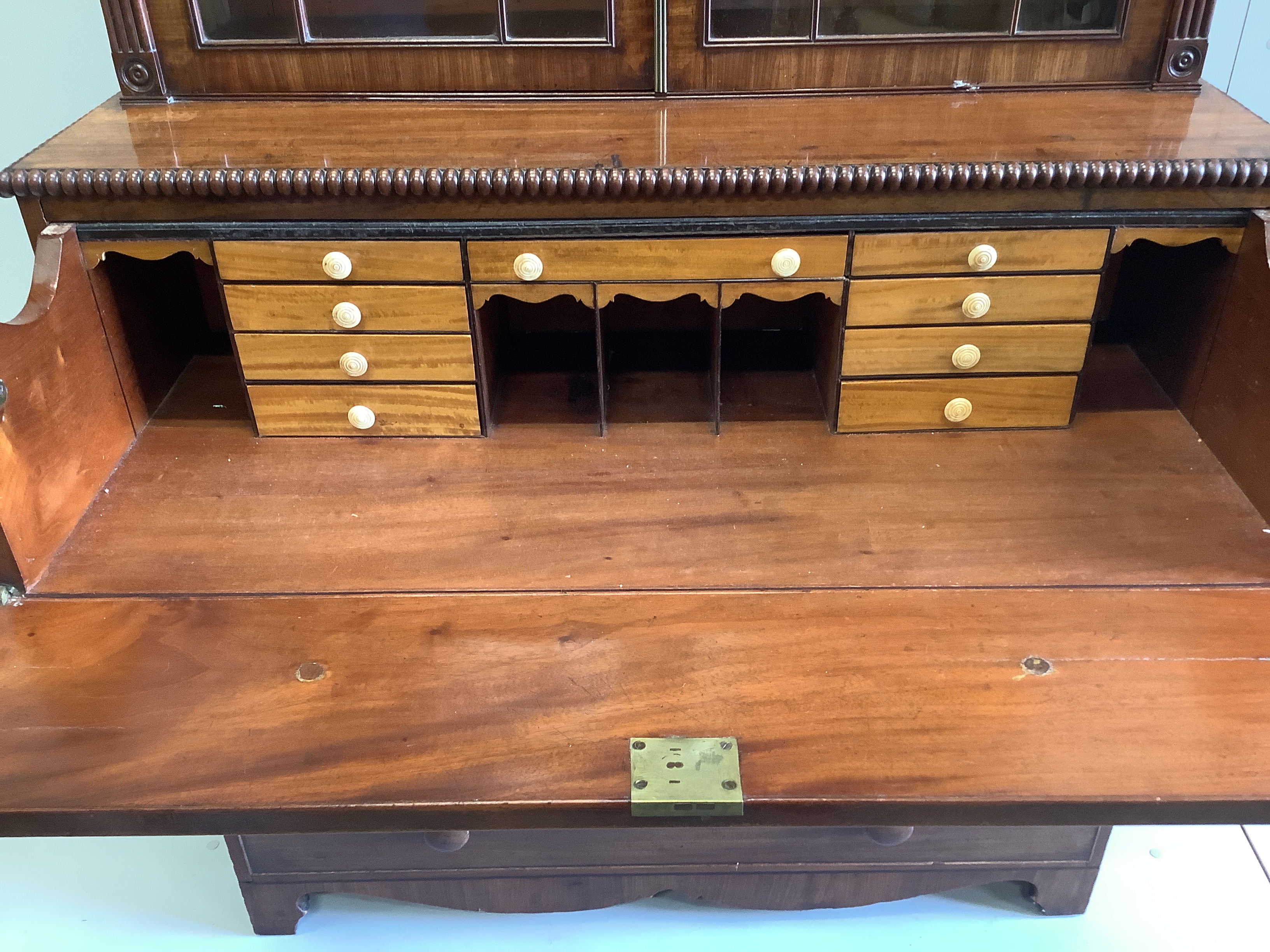 A Regency mahogany secretaire bookcase, the interior with turned ivory handles, width 106cm, depth 51cm, height 211cm (CITES Submission reference: 4R5H1VUJ)